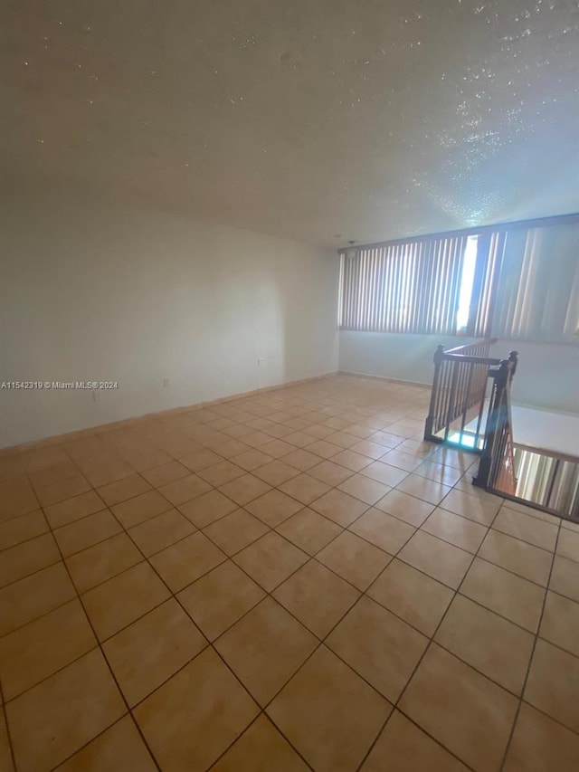 spare room with light tile flooring