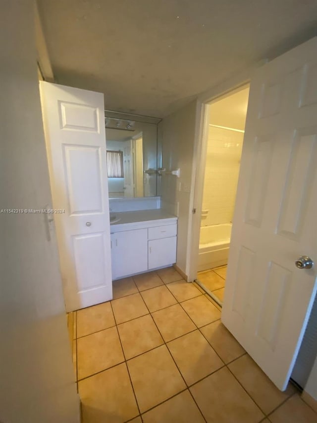 bathroom with tile floors and vanity