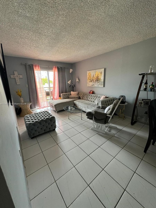 living room featuring light tile floors and a textured ceiling