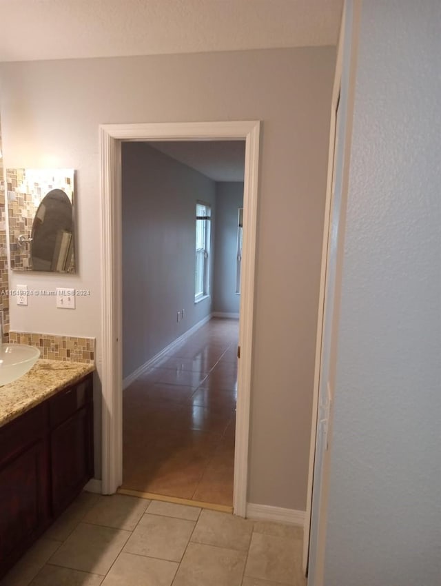 bathroom with vanity and tile patterned flooring