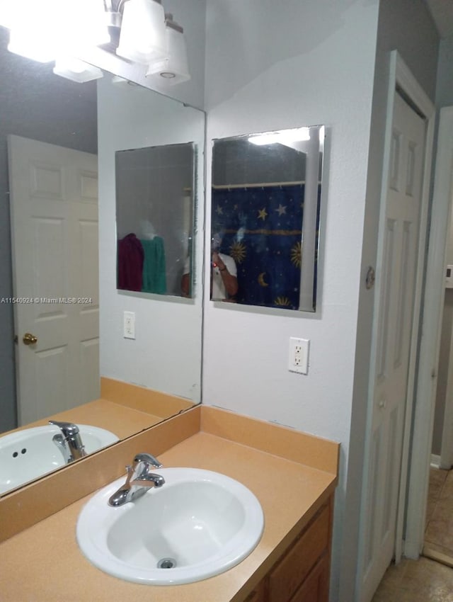 bathroom with vanity and tile patterned flooring