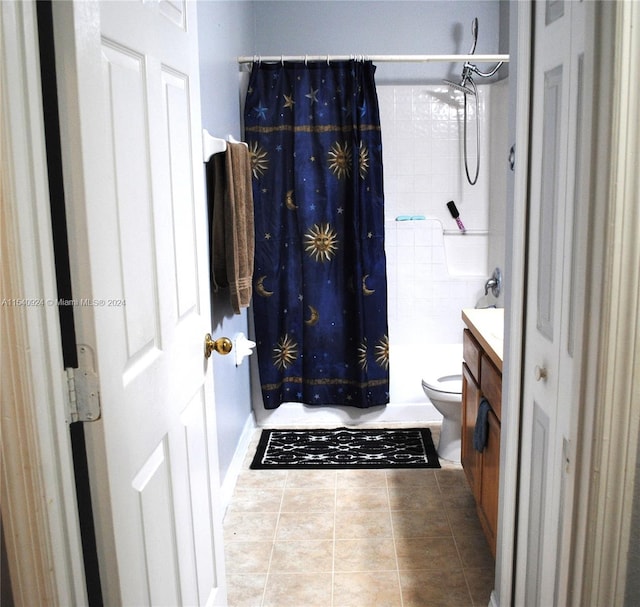 full bathroom featuring vanity, toilet, tile patterned floors, and shower / tub combo