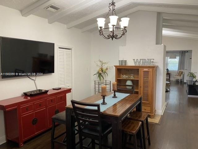 dining room featuring an inviting chandelier, vaulted ceiling with beams, and dark hardwood / wood-style flooring