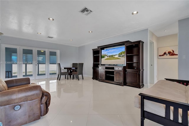 tiled living room featuring french doors