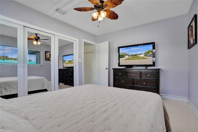 bedroom featuring ceiling fan and light tile patterned flooring