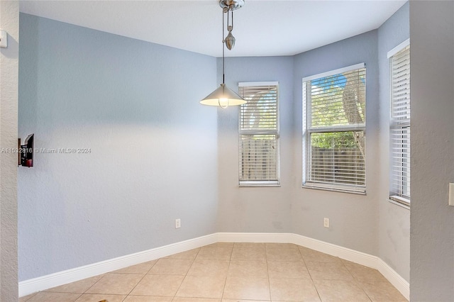 empty room with light tile floors