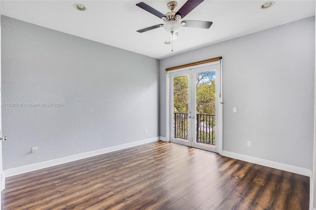 spare room with ceiling fan, dark hardwood / wood-style floors, and french doors