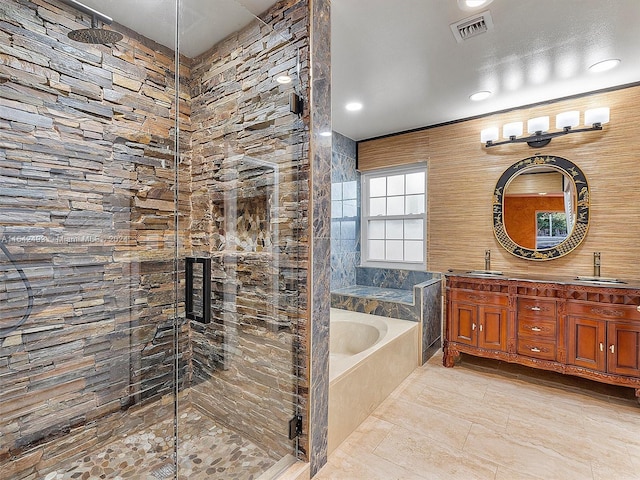 bathroom featuring tile flooring, independent shower and bath, double sink vanity, and a textured ceiling