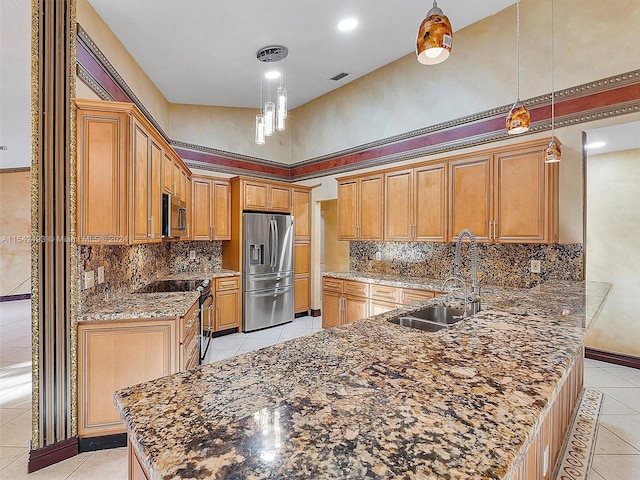 kitchen featuring appliances with stainless steel finishes, tasteful backsplash, pendant lighting, and dark stone countertops