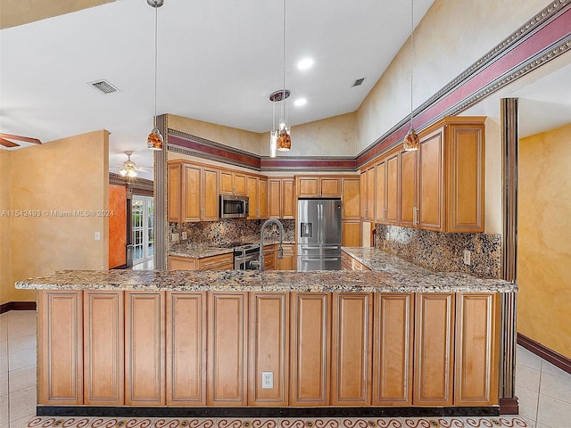 kitchen with kitchen peninsula, stainless steel appliances, ceiling fan, and light tile floors