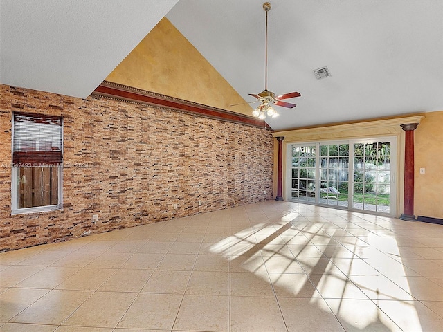 spare room with high vaulted ceiling, ceiling fan, and light tile floors