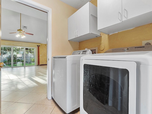 laundry area featuring washing machine and dryer, cabinets, ceiling fan, light tile flooring, and washer hookup