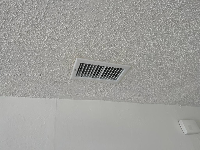 room details with a textured ceiling