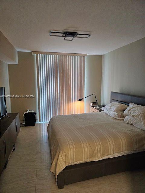 bedroom featuring a textured ceiling