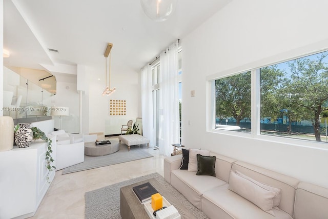 living room featuring light tile patterned floors and visible vents