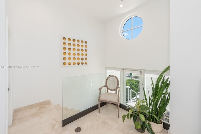 foyer entrance featuring recessed lighting and a towering ceiling