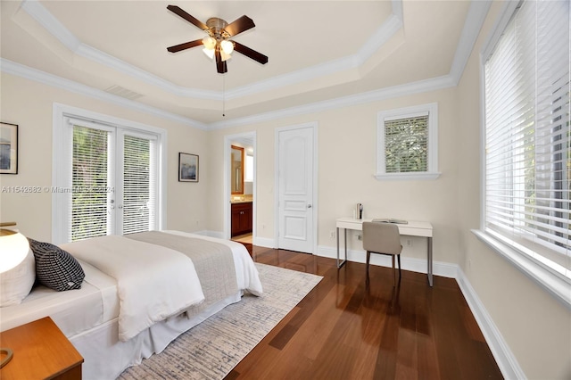 bedroom featuring french doors, crown molding, a tray ceiling, dark hardwood / wood-style flooring, and access to exterior