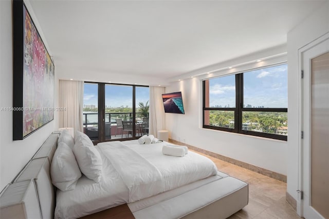 tiled bedroom featuring access to exterior