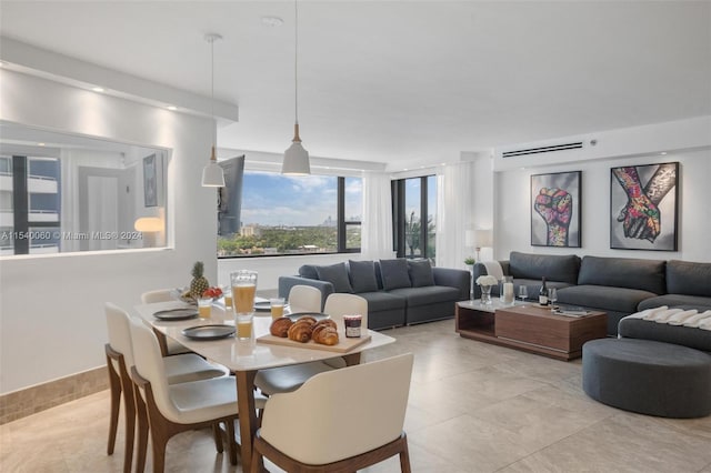 dining space featuring light tile floors