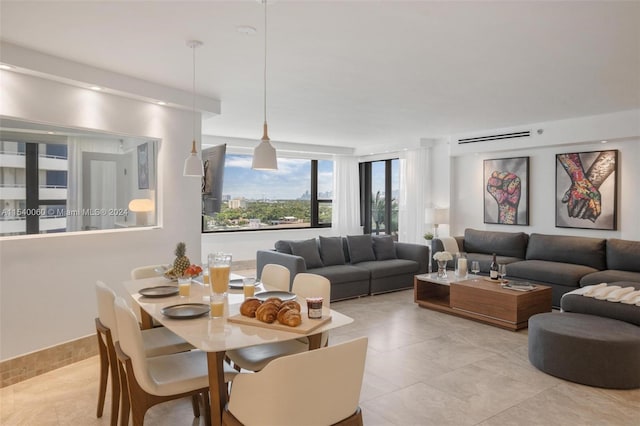 dining area featuring light tile flooring