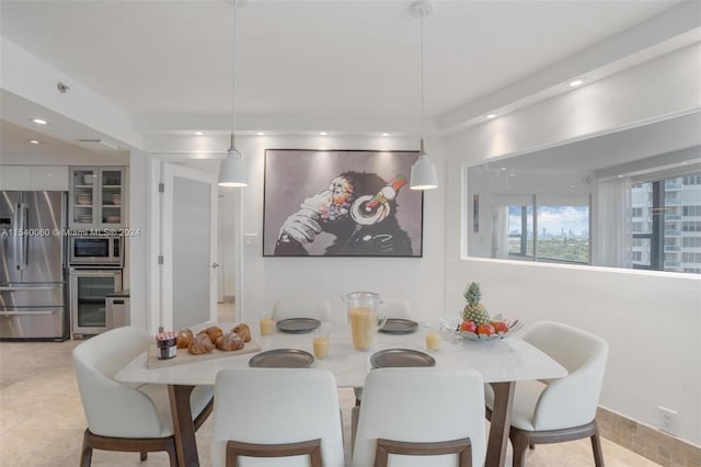 dining area with light tile flooring