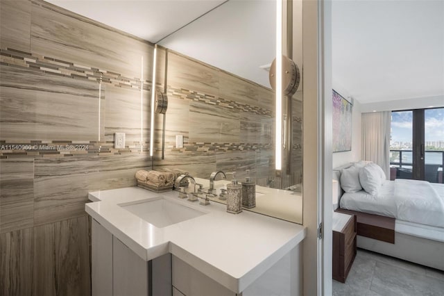 bathroom featuring tile floors and vanity