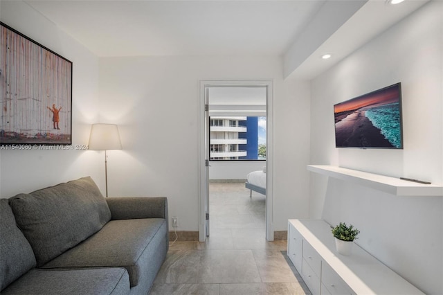 living room featuring light tile floors