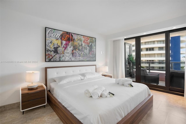 bedroom featuring light tile floors and access to outside