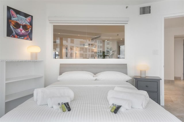 bedroom with light tile floors