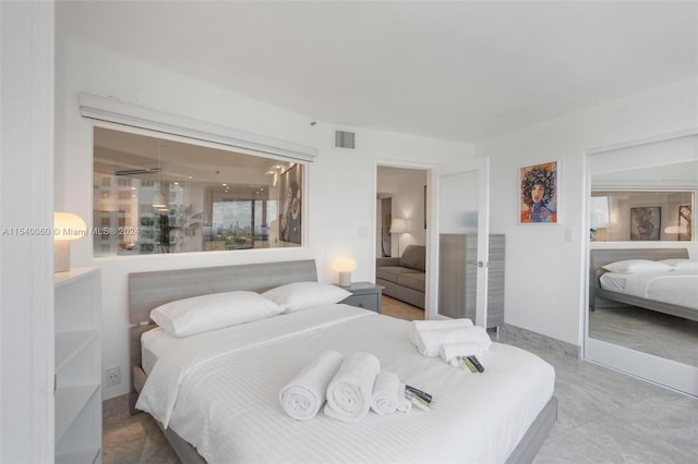 bedroom with tile floors