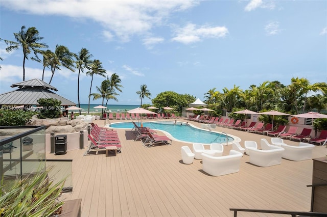 view of pool featuring a water view