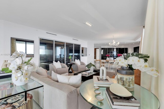 living room featuring an inviting chandelier