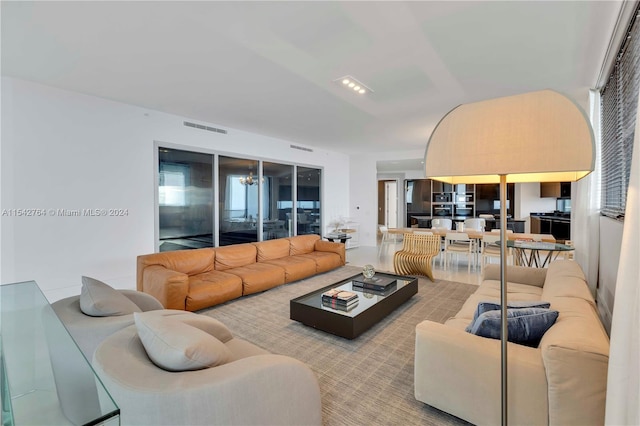 living room with a notable chandelier