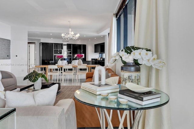 living room with a notable chandelier, recessed lighting, and wood finished floors