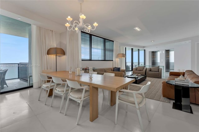 tiled dining room featuring an inviting chandelier