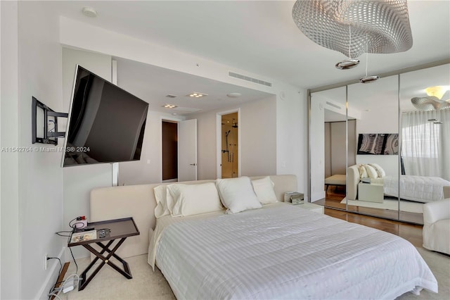 bedroom featuring a closet and light wood-type flooring