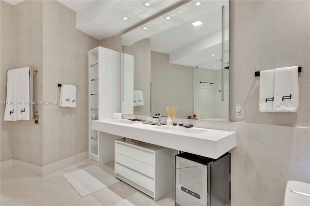 bathroom featuring tile floors and vanity