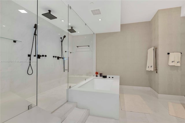 bathroom featuring separate shower and tub and tile floors