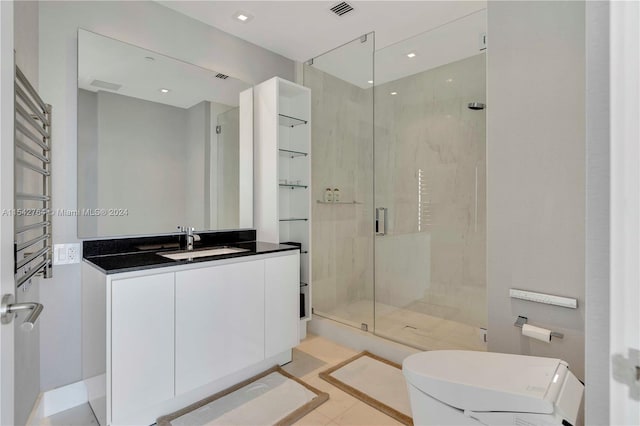 bathroom with walk in shower, toilet, tile floors, and vanity