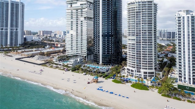 bird's eye view with a view of the beach and a water view