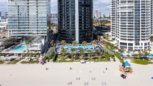 birds eye view of property with a water view and a city view