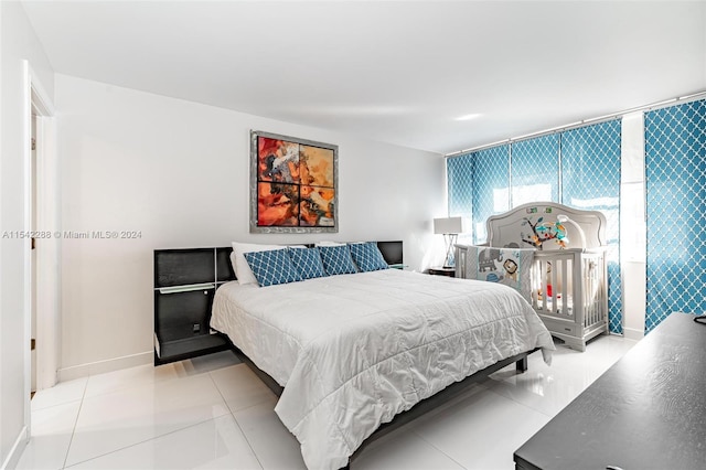 bedroom with light tile patterned floors