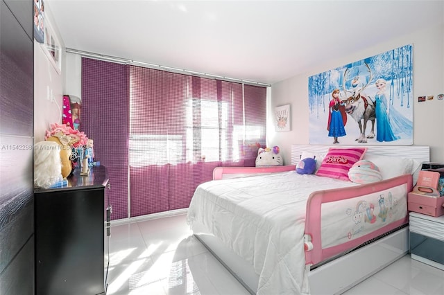 bedroom featuring tile patterned flooring