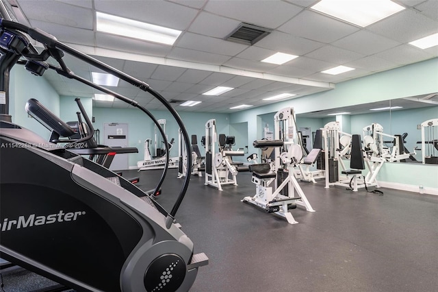 workout area featuring a paneled ceiling