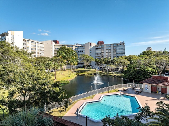 view of pool featuring a water view