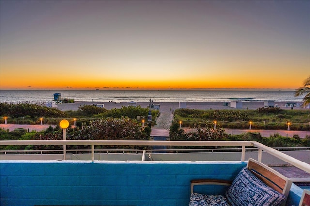 pool at dusk with a water view