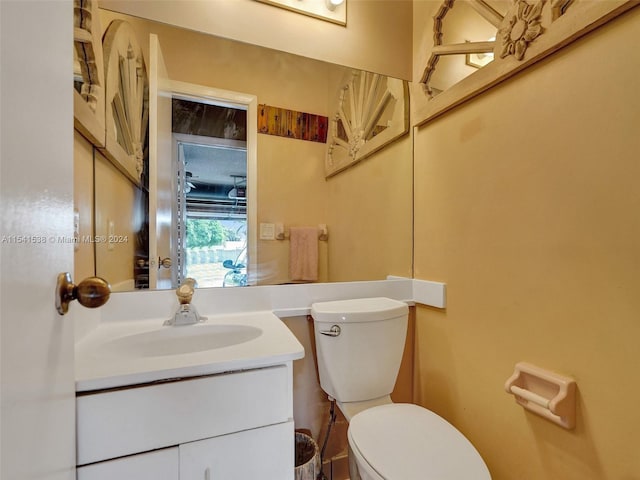 bathroom with oversized vanity and toilet