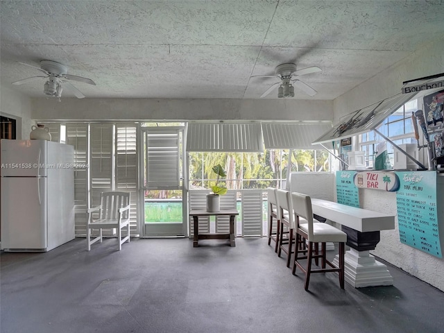 view of patio featuring ceiling fan