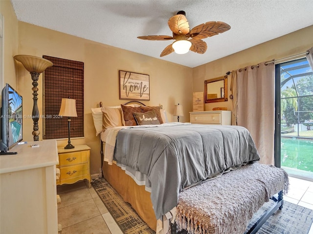 tiled bedroom featuring a textured ceiling, multiple windows, and ceiling fan