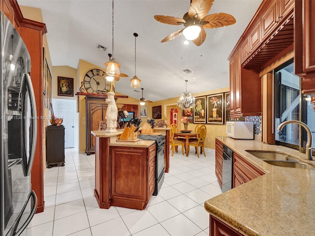 kitchen with hanging light fixtures, ceiling fan with notable chandelier, sink, and black appliances